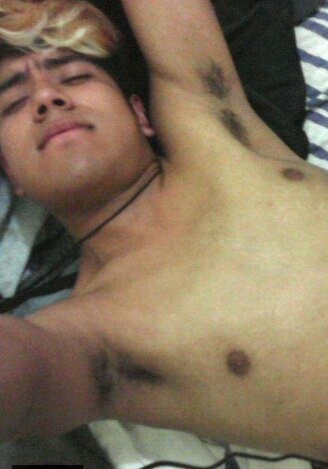 Mexican teenboy takes a selfie and shows his hairy armpit
